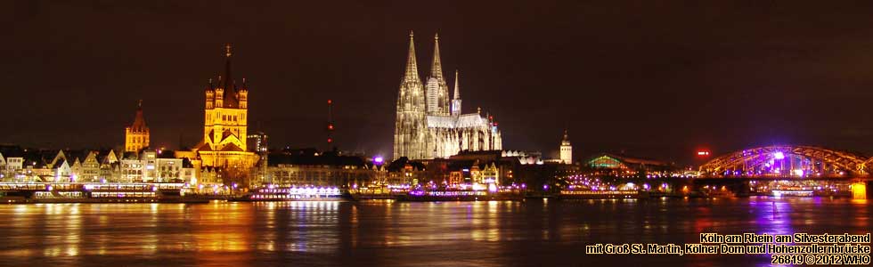 Cologne on the Rhine River with boats on early New Years Eve Evening.